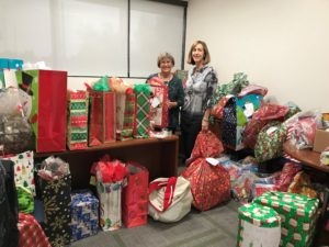 Helen Harrold and Karen Crawford take part in the “Be a Santa to a Senior” program.